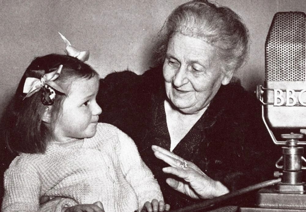 Maria Montessori with children